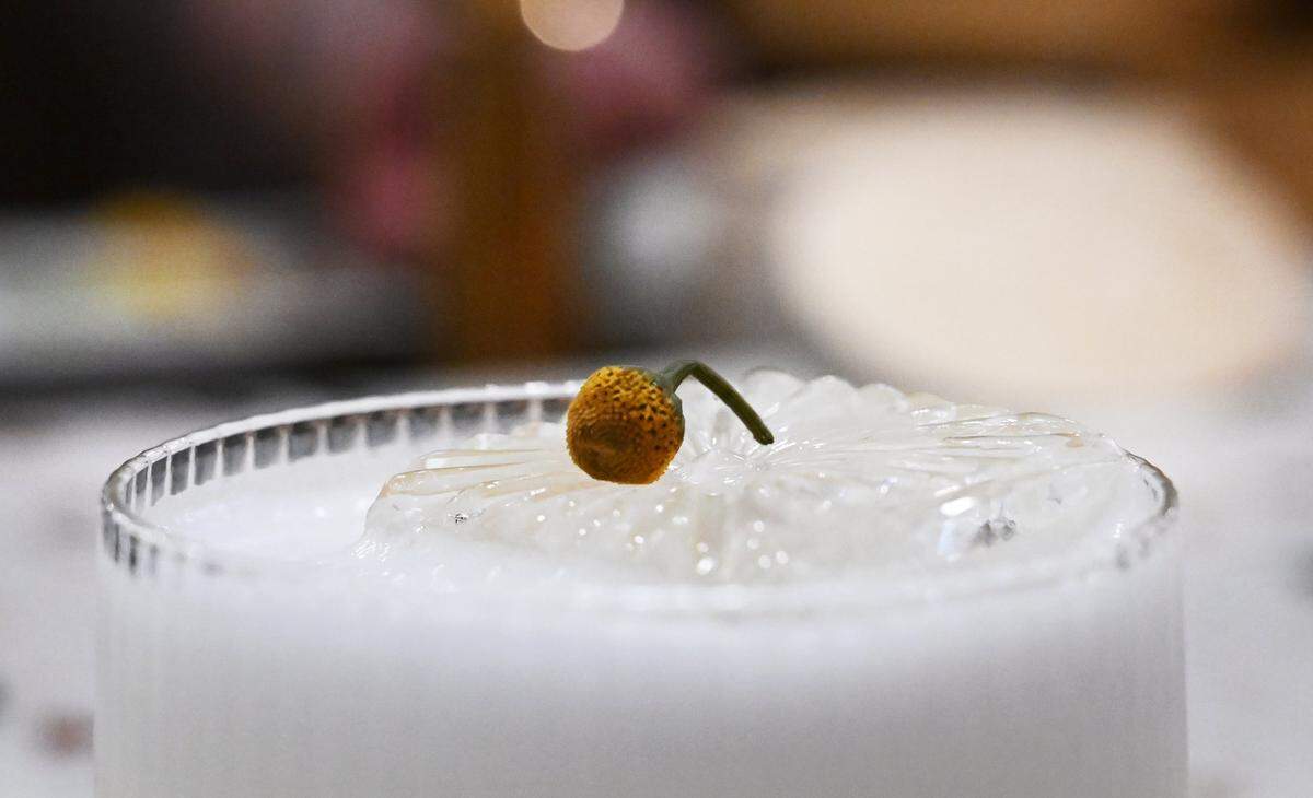 A Buzz Button flower tops a Golden Hour Saffron Sour cocktail Wednesday, Feb. 4, 2026 in Fresno.