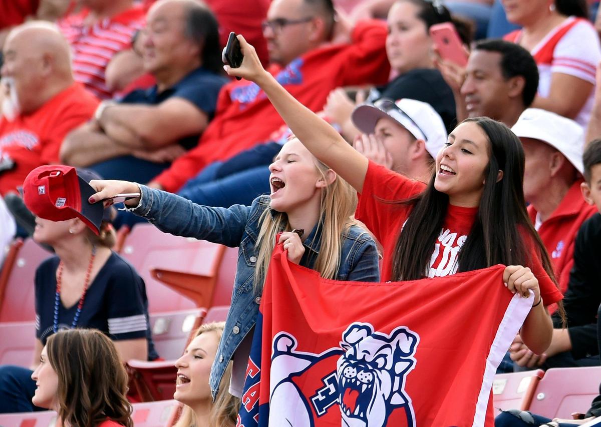 Fans cheer on Fresno State in a 28-17 victory over Boise Stat Saturday, Nov. 24, 2017 at Bulldog Stadium in Fresno. The Bulldogs averaged 30,632 for six home dates last season, ranking fourth in the Mountain West Conference in home attendance.