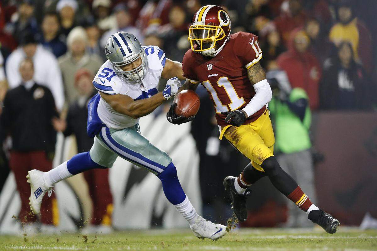 Washington Redskins wide receiver DeSean Jackson (11) carries the ball on a kickoff return under pressure from Dallas Cowboys outside linebacker Kyle Wilber (51) during the second half of an NFL football game in Landover, Md., Monday, Dec. 7, 2015.