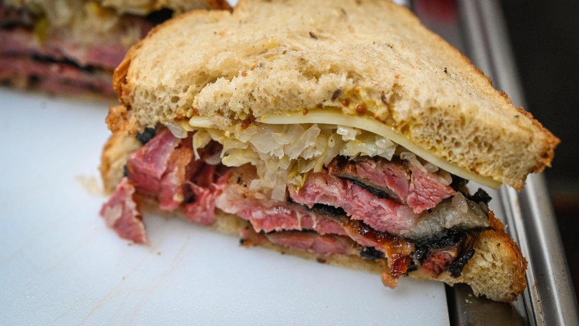 A double-decker pastrami sandwich prepared at the new Duck Haus food truck at The Well Community Church in Fresno on Thursday, March 11, 2022.