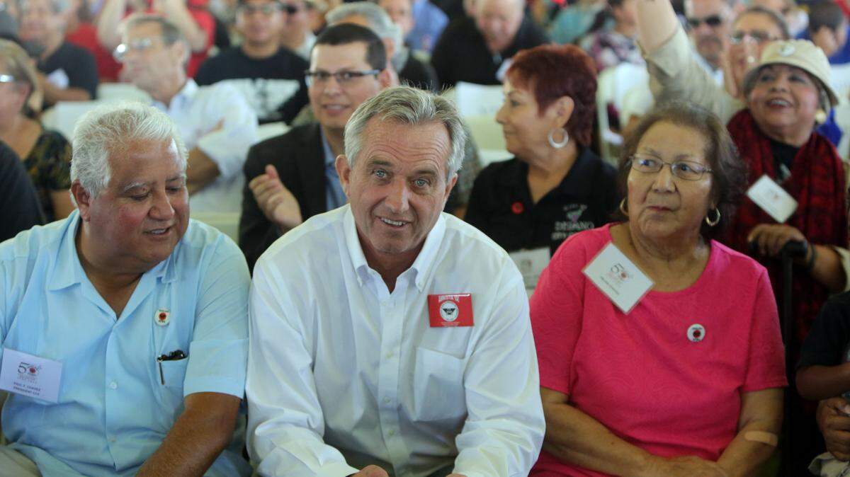 Robert F. Kennedy Jr., sitting between Paul Chávez and Helen Chávez, was among about 1,000 United Farm Workers supporters at Forty Acres near Delano for the 50th anniversary celebration of the Delano grape strike.