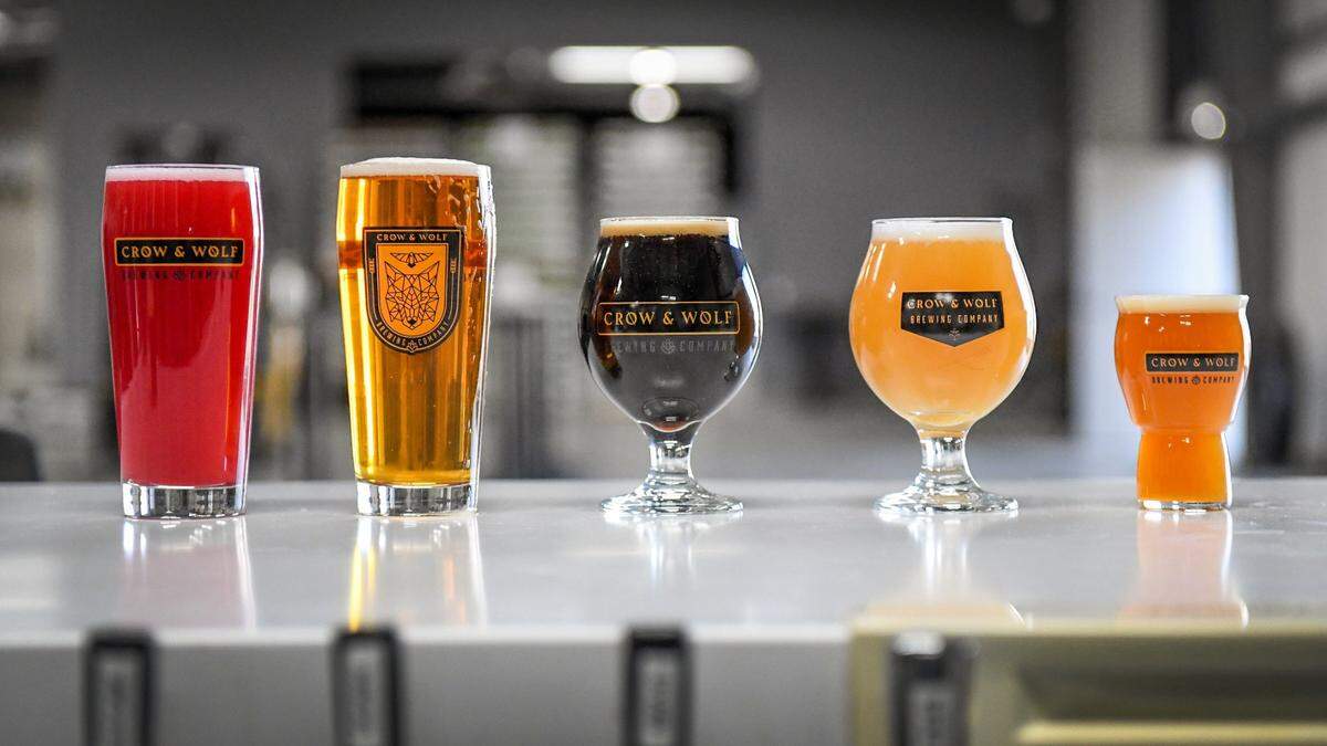 A selection of brews from Crow & Wolf Brewing in Clovis are pictured in this Fresno Bee file photo. From left, berry seltzer, Maya lager, Odyssey stout, Stargazer hazy IPA, and Cobblestone apricot sour.