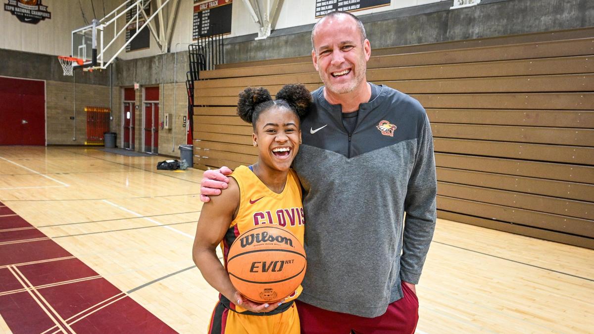 Clovis West girls basketball player Athena Tomlinson, The Fresno Bee’s high school girls basketball Player of the Year, is photographed with coach Craig Campbell, named Coach of the Year, on Monday, March 27, 2023.