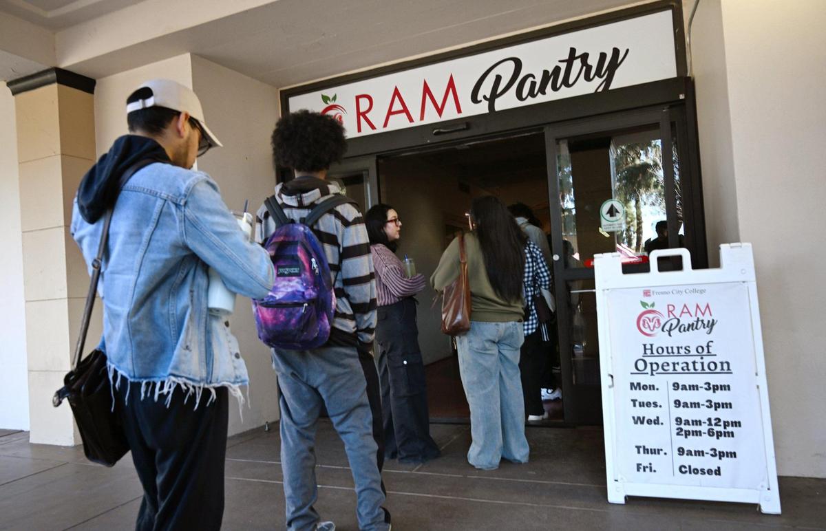 Students stand in line for the Ram Pantry at Fresno City College Monday, Jan. 13, 2025 in Fresno. Ram Pantry is a free food assistance program for students currently enrolled at Fresno City College.