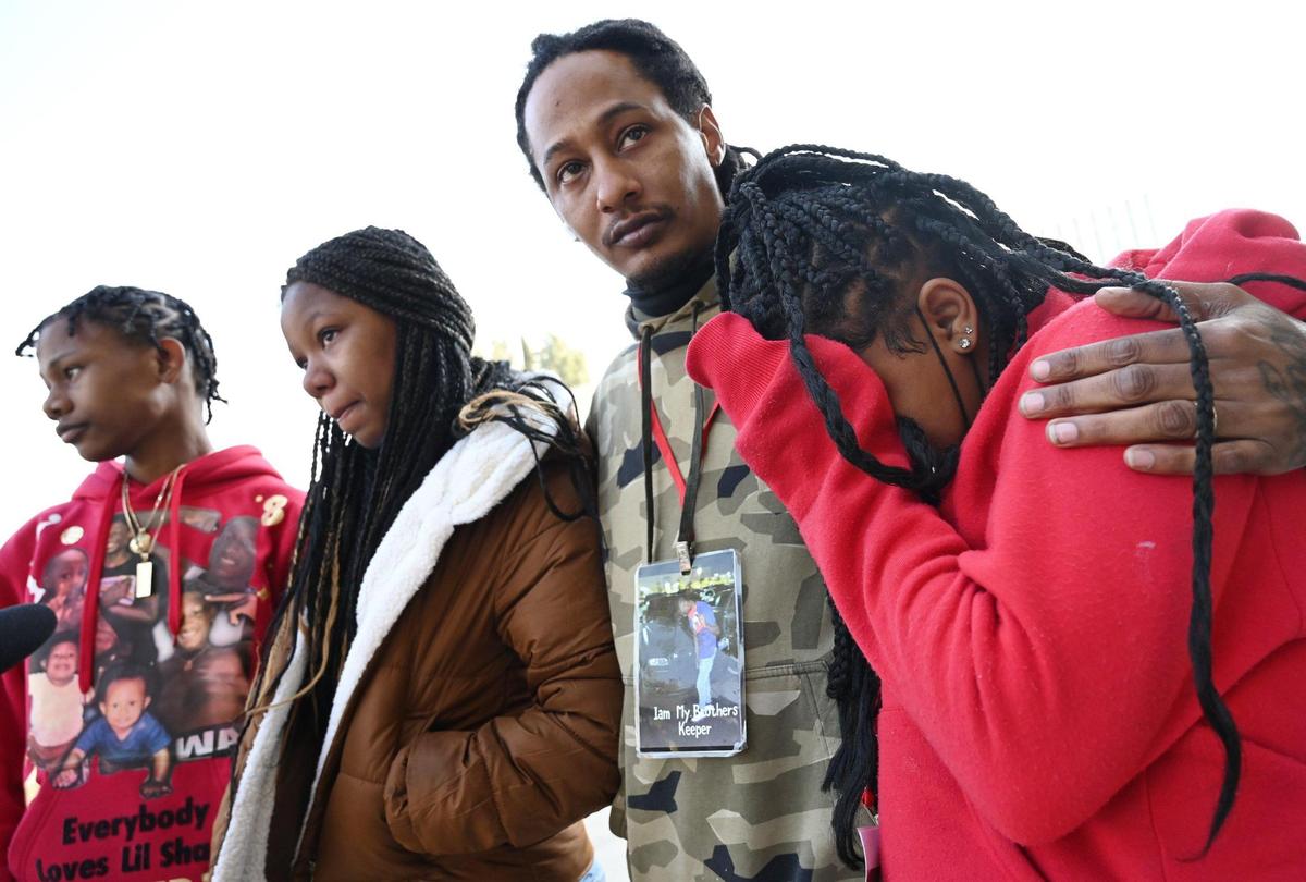Rashad Hakim, second from right, comforts his remaining children Jaazara Al-Hakim, 11, right, and Leearah Al-Hakim, 12, second from left, with son Rodney Al-Hakim to the far left following a rally demanding justice for Rashad Al-Hakim Jr., outside the Fresno County Courthouse Monday morning, Jan. 23, 2023 in Fresno. Rashad is the 15-year old Hoover High School student killed in a hit and run Oct. 4, 2022. The accused driver, Lisa Ellen Spoors, received reduced bail and left jail January 19.