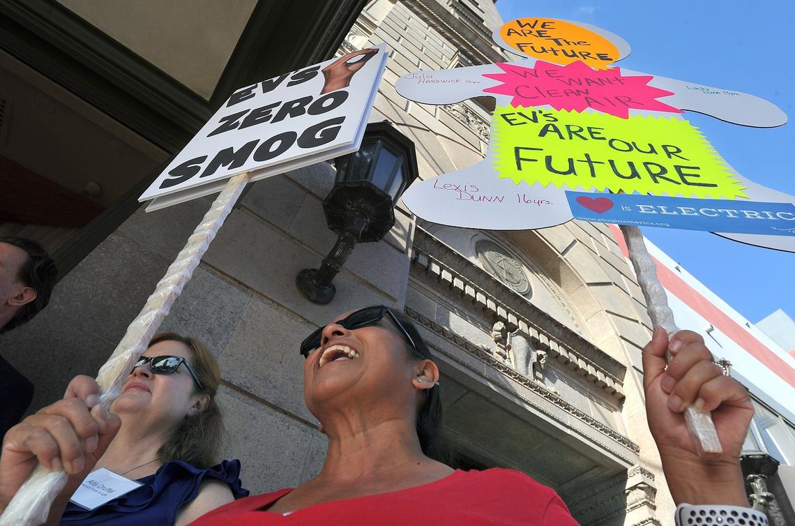 Linda Dunn, a Tesla owner from Clovis, chants as she joins other clean car advocates gather outside The Grand for the EPA/National Traffic Safety Administration hearing on the Trump Administration’s proposed vehicle emissions standards on Monday morning, Sept. 24, 2018.