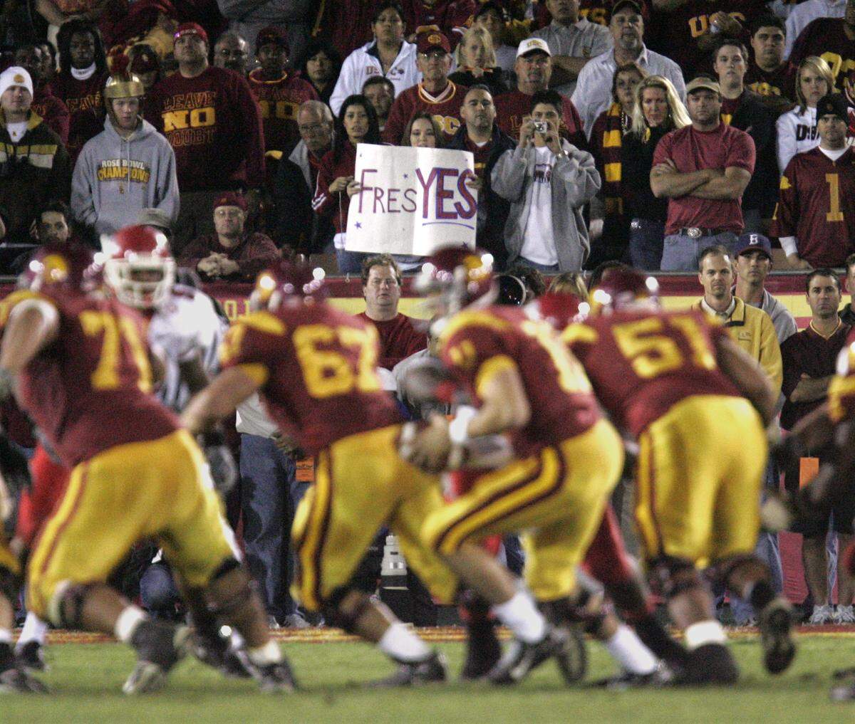 A Fresno State fan displays a sign with her support of Fresno State during the Fresno State USC football game at the Los Angeles Memorial Coliseum on November 19, 2005.