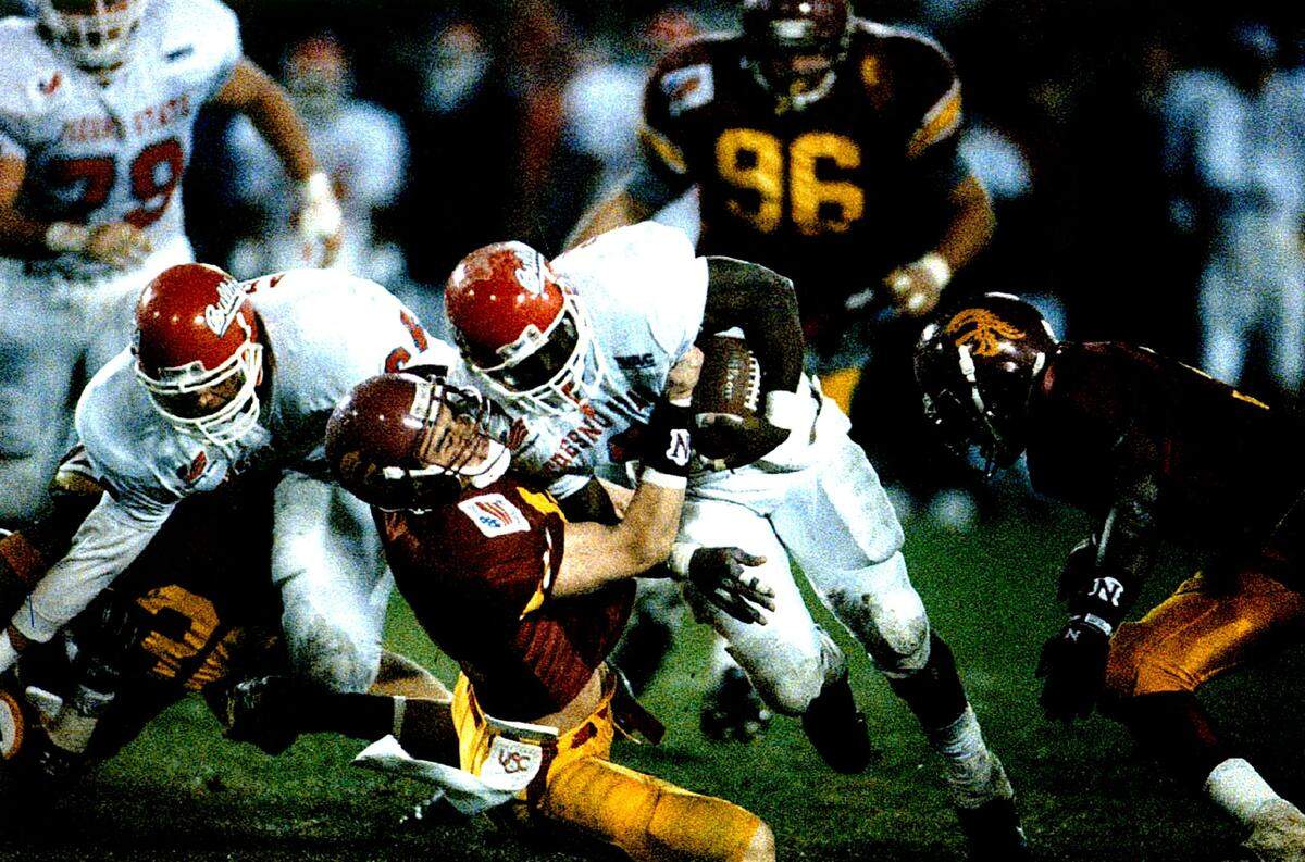Fresno State running back Anthony Daigle powers into a USC defender during the Bulldogs’ 24-7 Freedom Bowl victory.