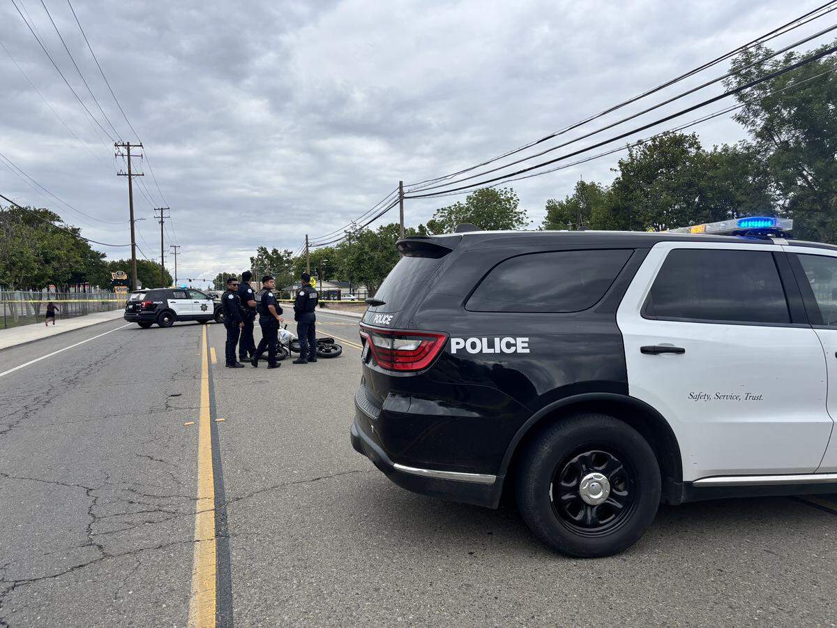 Officers investigate an e-bike collision in front of Edison High in Fresno, California on Sunday, April 26, 2026.