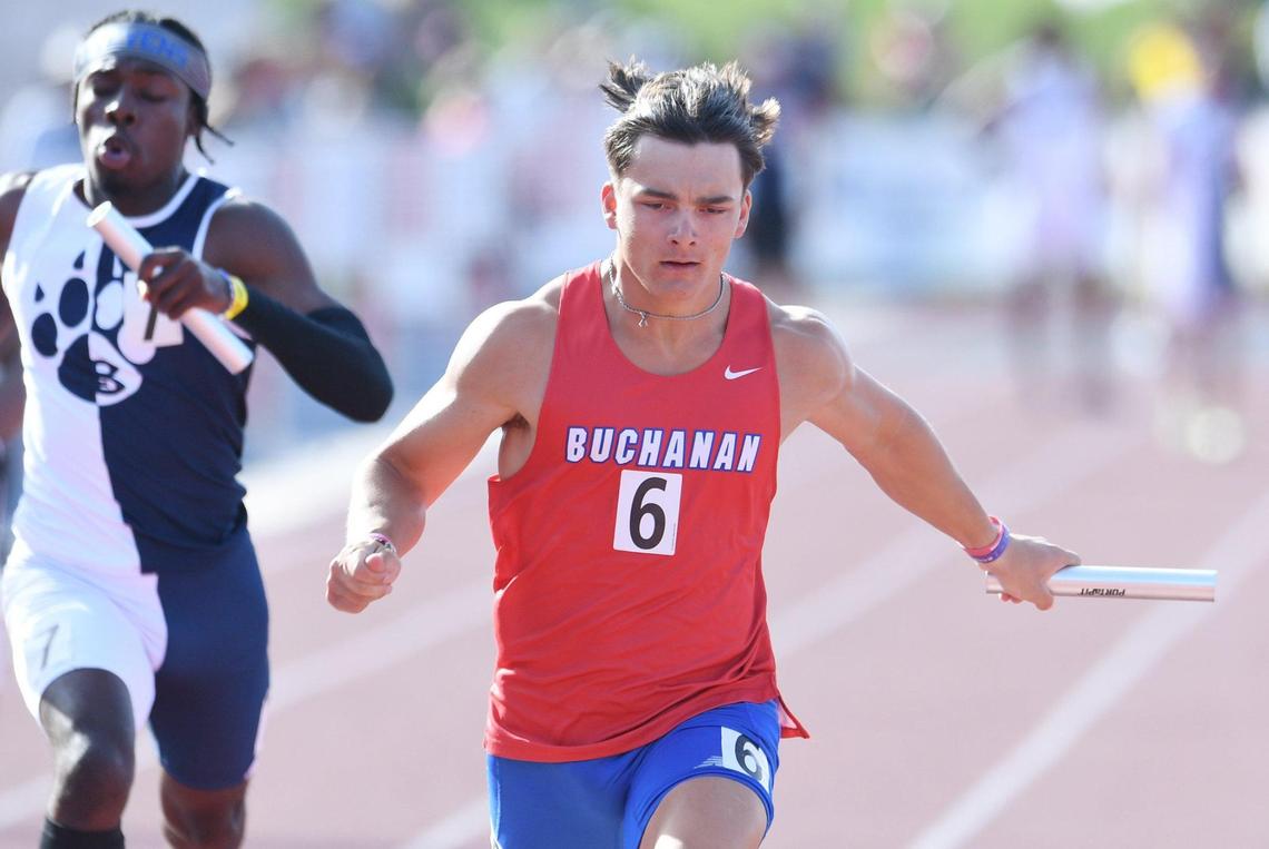 Buchanan’s anchor Hilton Green crosses for second place in the third heat of the Boys 400 Relay at the CIF State Track and Field Championships Friday, May 27, 2022 in Clovis.