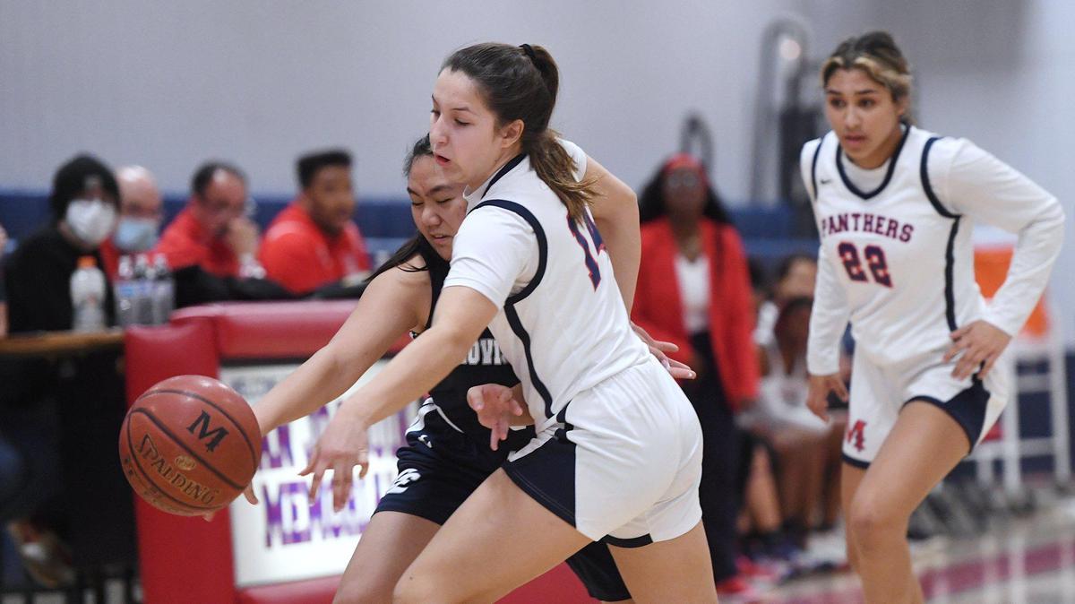 File photo of San Joaquin Memorial’s Sienna Evans, right.