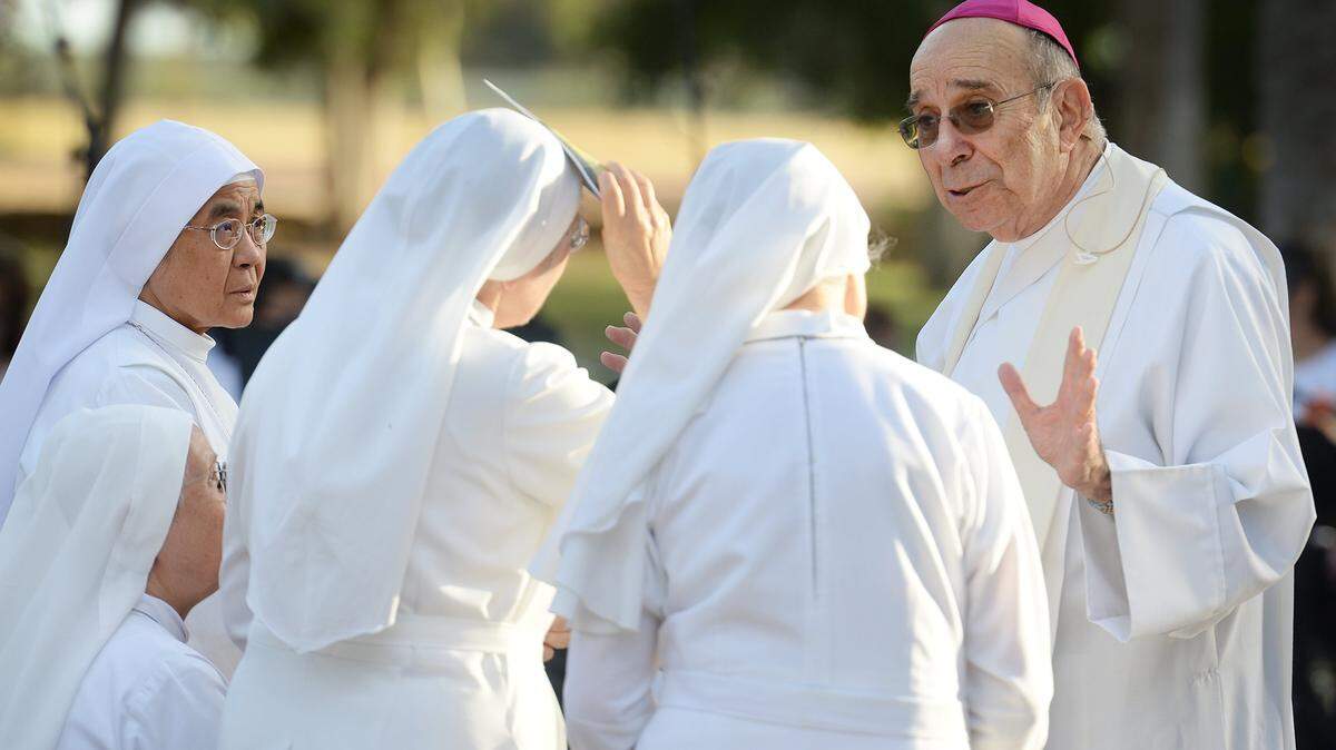Bishop Armando X. Ochoa of the Roman Catholic Diocese of Fresno visits with Sister Disciples of the Devine Master before holding a mass at Kearney Park as part of the Roman Catholic Diocese of Fresno’s 50th anniversary conducted through their mobile chapel on Monday, Sept. 19, 2017.
