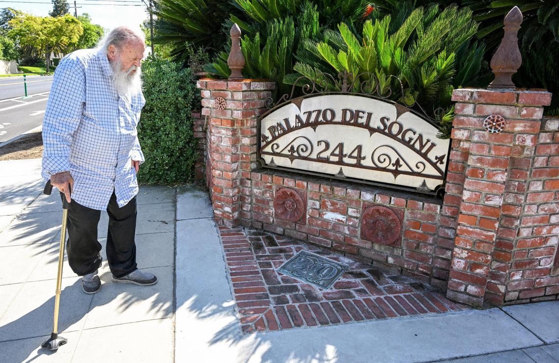 Jim Williams stops by the corner sign with the name “Palazzo Del Sogni” in front of his home in the Fresno High area. The name means Palace of Dreams in Italian.