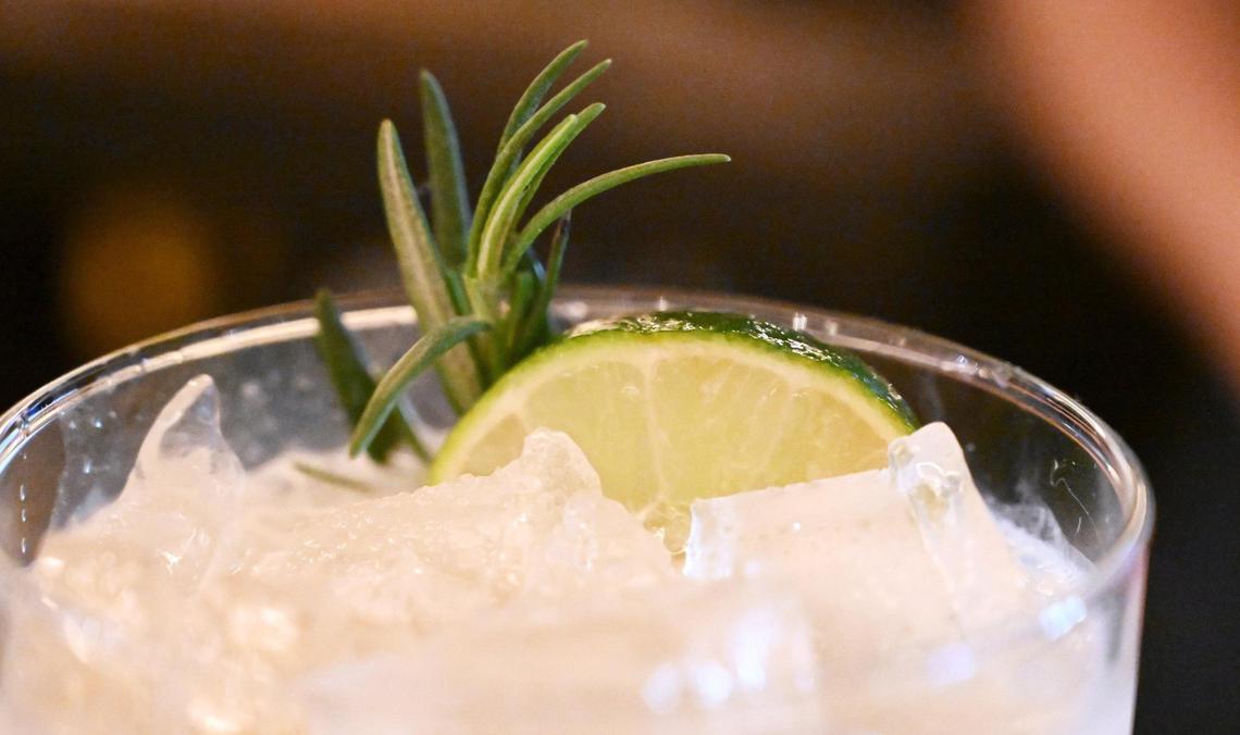 A slice of lime and rosemary garnish the popular Baby Got Daq cocktail at The Standard. The north Fresno bar and restaurant has an entirely new cocktail menu.