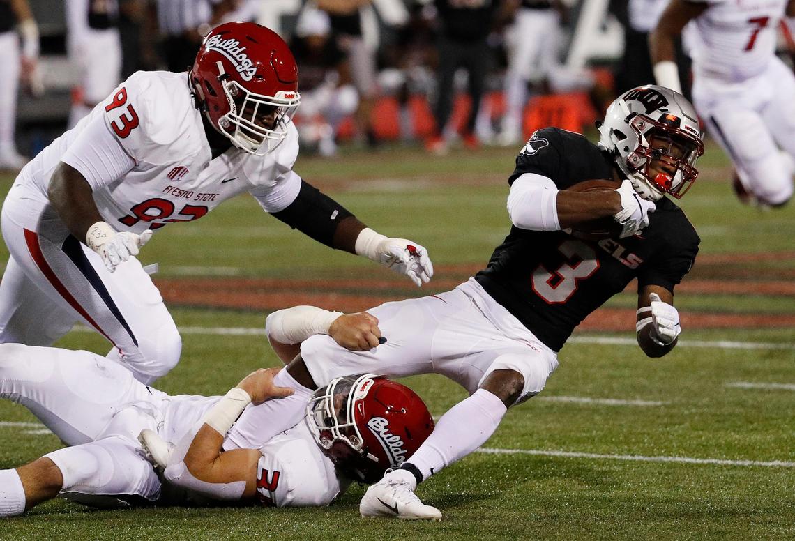 Fresno State Bulldogs linebacker George Helmuth (34) tackles UNLV Rebels running back Lexington Thomas (3) during the Bulldogs’ 48-3 victory at Sam Boyd Stadium in Las Vegas Saturday, Nov. 3, 2018. Helmuth was in on eight tackles including four solo in the victory.