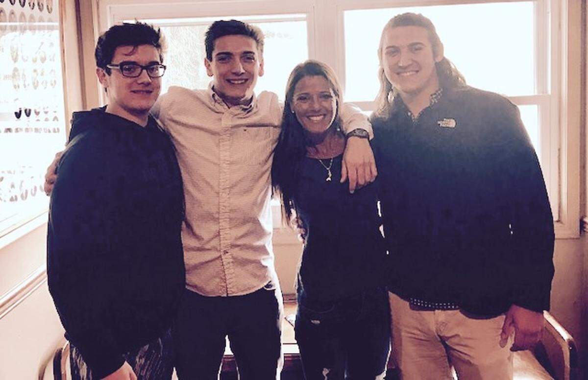 Tiffany Dow, center, with her three sons, from left, Ben, Sam and Jack.