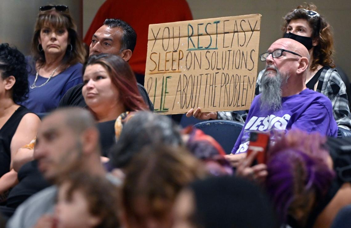 Audience members listen as homeless advocates speak out against a proposed ordinance against camping on city sidewalks and public property during a special Fresno City Council meeting Monday, July 29, 2024 in Fresno.