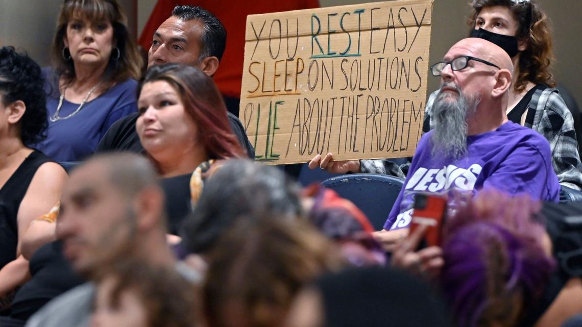 Audience members listen as homeless advocates speak out against a proposed ordinance against camping on city sidewalks and public property during a special Fresno City Council meeting Monday, July 29, 2024 in Fresno.