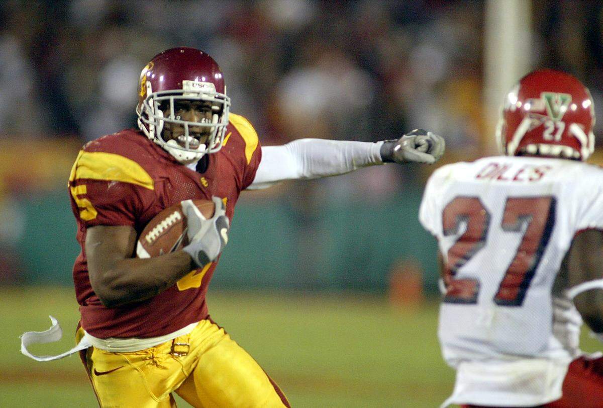 USC's Reggie Bush makes a move against Fresno State's Awan Diles during their game at the Los Angeles Memorial Coliseum on Saturday night November 19, 2005.