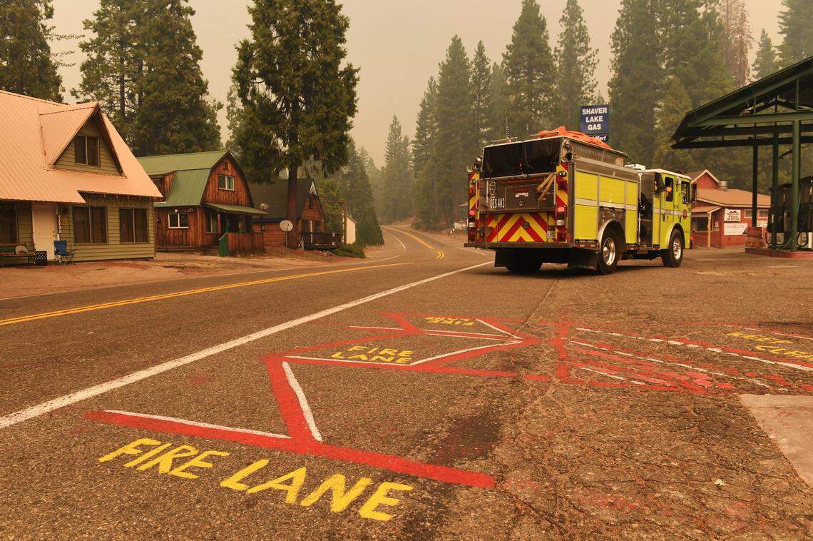 A fire truck with the Governor’s Office of Emergency Services makes a U-turn in a deserted Shaver Lake community that was evacuated due to the Creek Fire Sunday, Sept. 6, 2020.