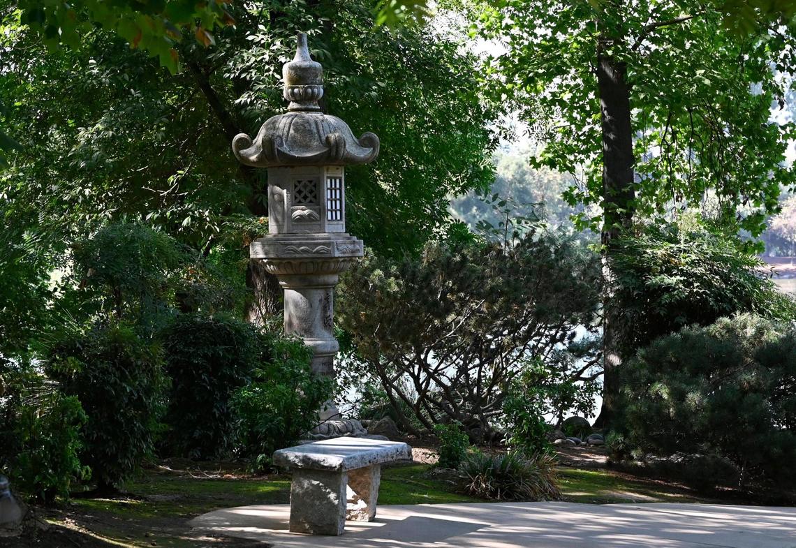 A stone lantern is een along a pathway inside Fresno’s Shinzen Friendship Garden in Woodward Park Wednesday, Sept 4, 2024 in Fresno.