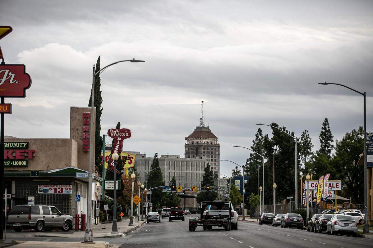 Dark clouds move over downtown Fresno in this Bee file photo from October 2021.