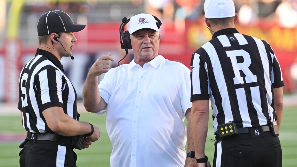 Fresno State head football coach Jeff Tedford talks with the officials during a timeout of their game against Eastern Washington at Valley Children’s Stadium on Saturday, Sept. 9, 2023.