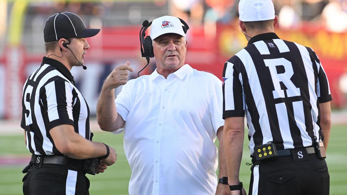 Fresno State head football coach Jeff Tedford talks with the officials during a timeout of their game against Eastern Washington at Valley Children’s Stadium on Saturday, Sept. 9, 2023.