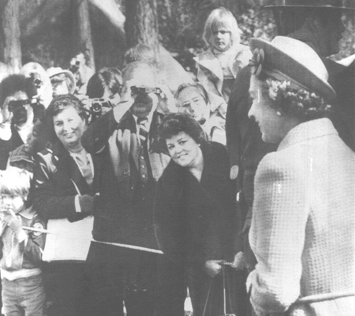 Queen Elizabeth II faces an eager horde of park visitors and their cameras during her 1983 visit to Yosemite National Park.
