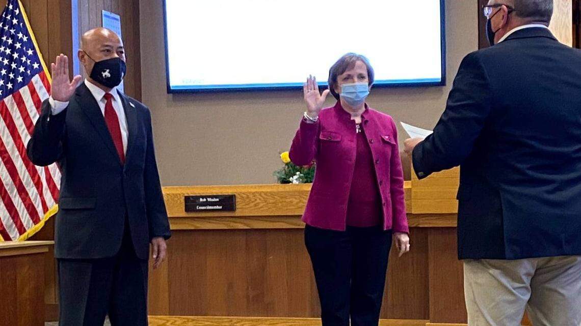 Incumbent Councilmembers Lynne Ashbeck, right, and Vong Mouanoutoua were sworn in for new terms on Monday, March 22, 2021, during a special meeting.