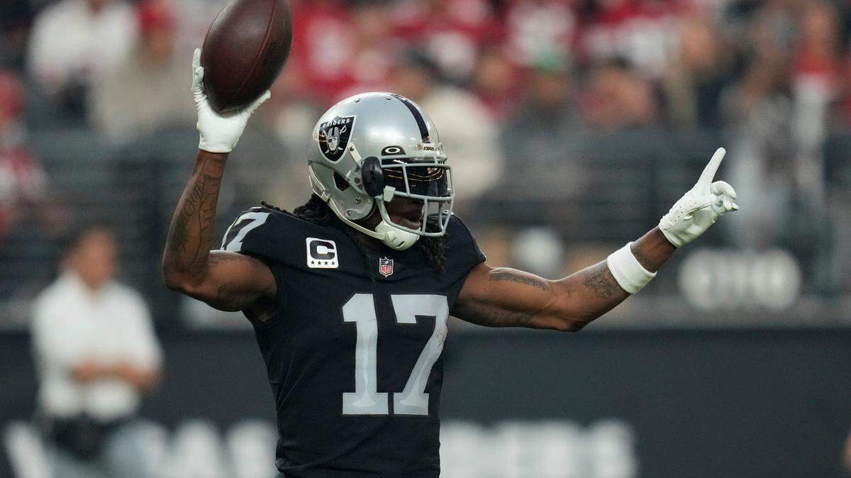Las Vegas Raiders wide receiver Davante Adams reacts after scoring a 60-yard touchdown during the second half of an NFL game between the San Francisco 49ers and Las Vegas Raiders, Sunday, Jan. 1, 2023, in Las Vegas.