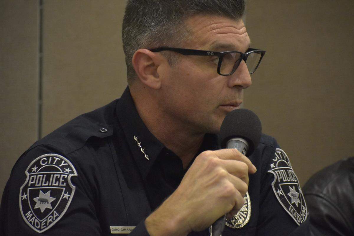 Madera Police Chief Giachino Chiaramonte addresses residents concerned about immigration enforcement during a packed community meeting Tuesday, Feb. 11, 2025.