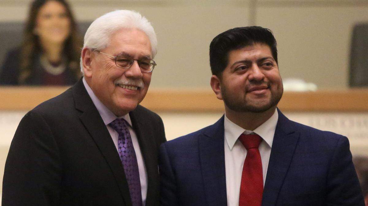 Fresno County Supervisor Sal Quintero, left, swore in his former chief of staff Luis Chavez in a 2019 ceremony to launch Chavez’ second term on the Fresno City Council. Chavez announced plans to run for Quintero’s seat on the county Board of Supervisors in 2024, and Quintero said he will run for re-election.