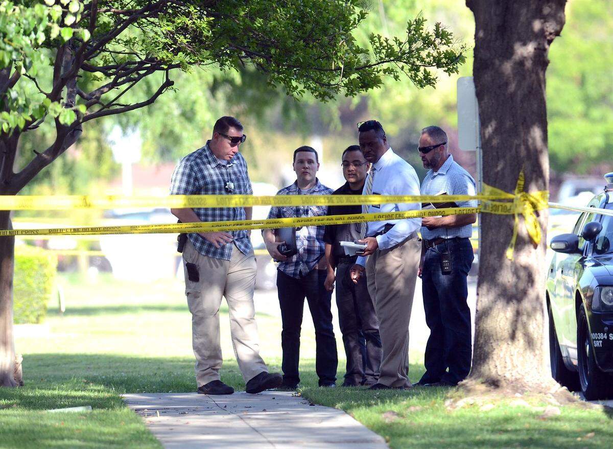 Fresno police detectives gather at the scene of a police shooting in which 16-year-old Isiah Murrietta-Golding was fatally shot on April 15, 2017, near the New Discovery Life preschool at First Street and Keats Avenue , north of Shaw Avenue.