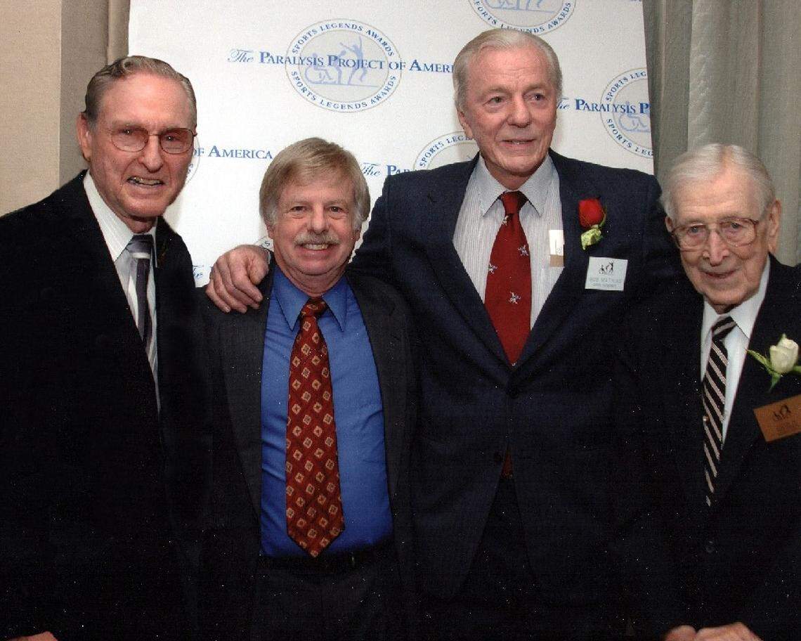 From left to right, Olympic decathlon gold medalist Bob Mathias, Los Angeles Times TV/radio columnist Larry Stewart, NBA Hall of Famer Bill Sharman of Porterville and legendary UCLA college basketball coach John Wooden pose for a photo at a 2007 charity event.