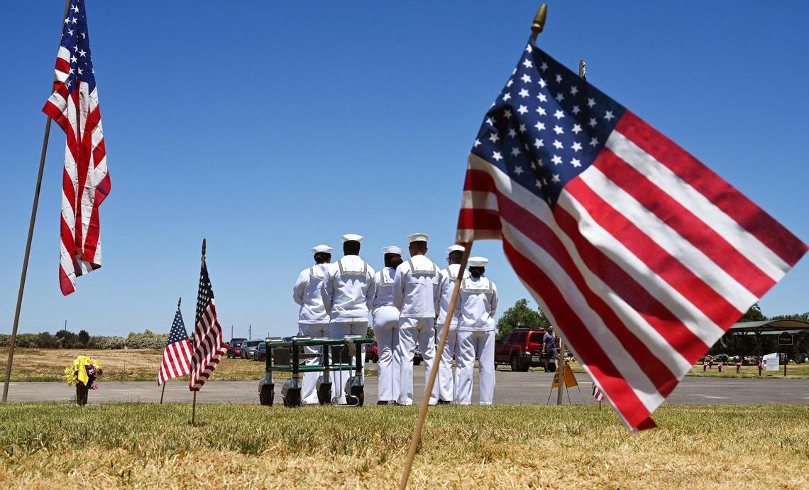 An honor guard detail awaits the arrival of the remains of Seaman 2nd Class Denver True “D.T.” Kyser at Fresno Memorial Gardens Saturday afternoon, May 21, 2022 in Fresno.