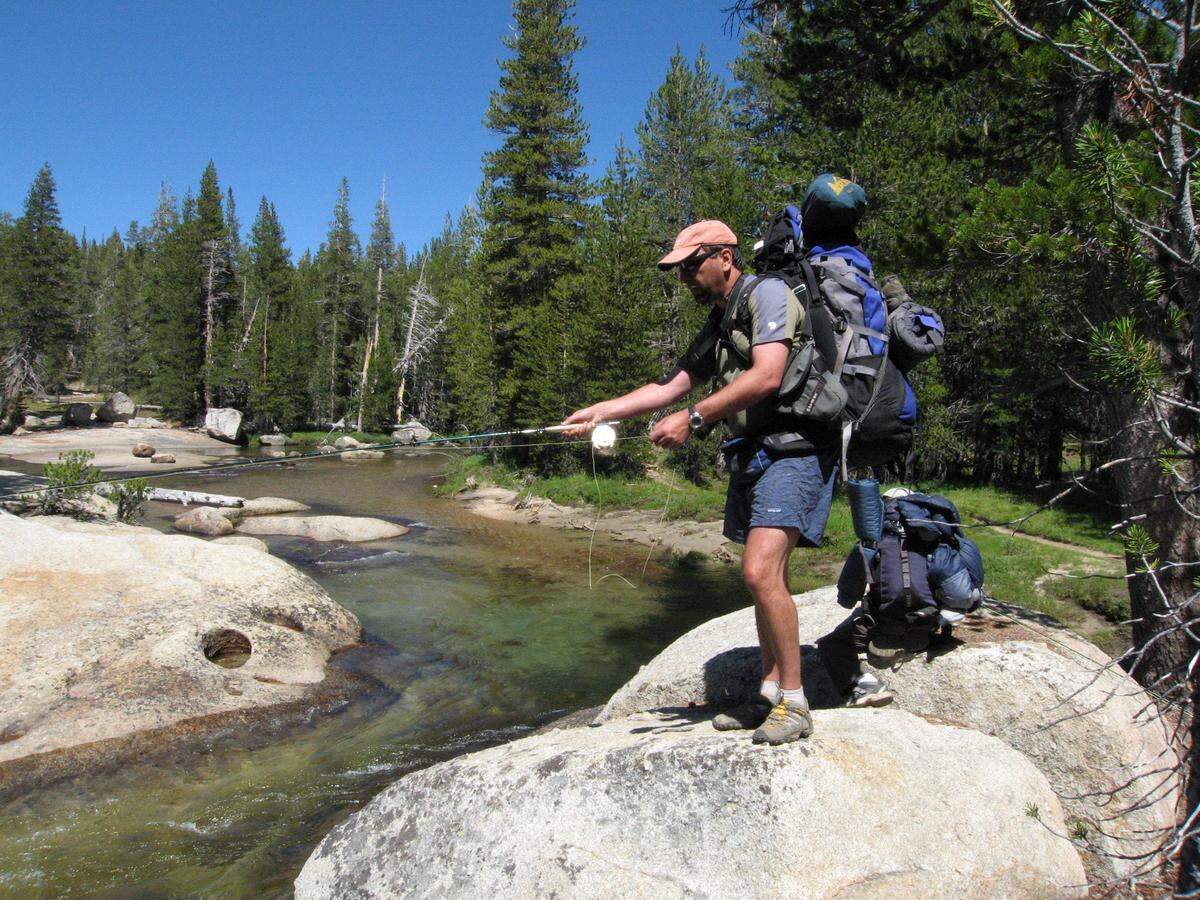 Ken Mendoza of Oakland fishes on the Lyell Fork of the Tuolumne River in the Tuolumne Meadows area of Yosemite National Park near the John Muir Trail in August 2008.