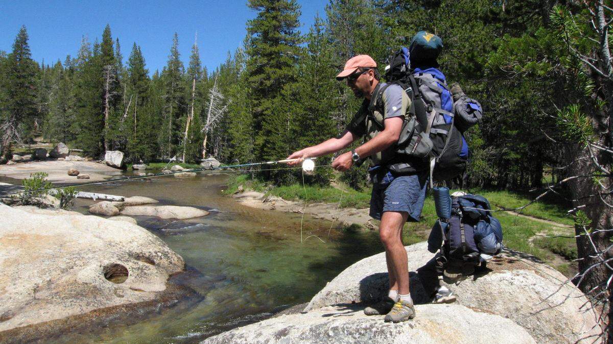 Ken Mendoza of Oakland fishes on the Lyell Fork of the Tuolumne River in the Tuolumne Meadows area of Yosemite National Park near the John Muir Trail in August 2008.