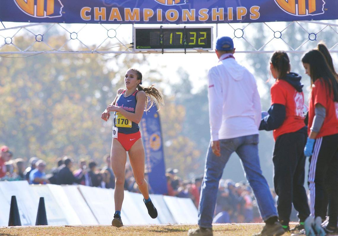 Buchanan’s Sydney Sundgren, left, places third in the Division I race at the CIF state cross country championships held at Woodward Park Saturday, Nov. 27, 2021 in Fresno.