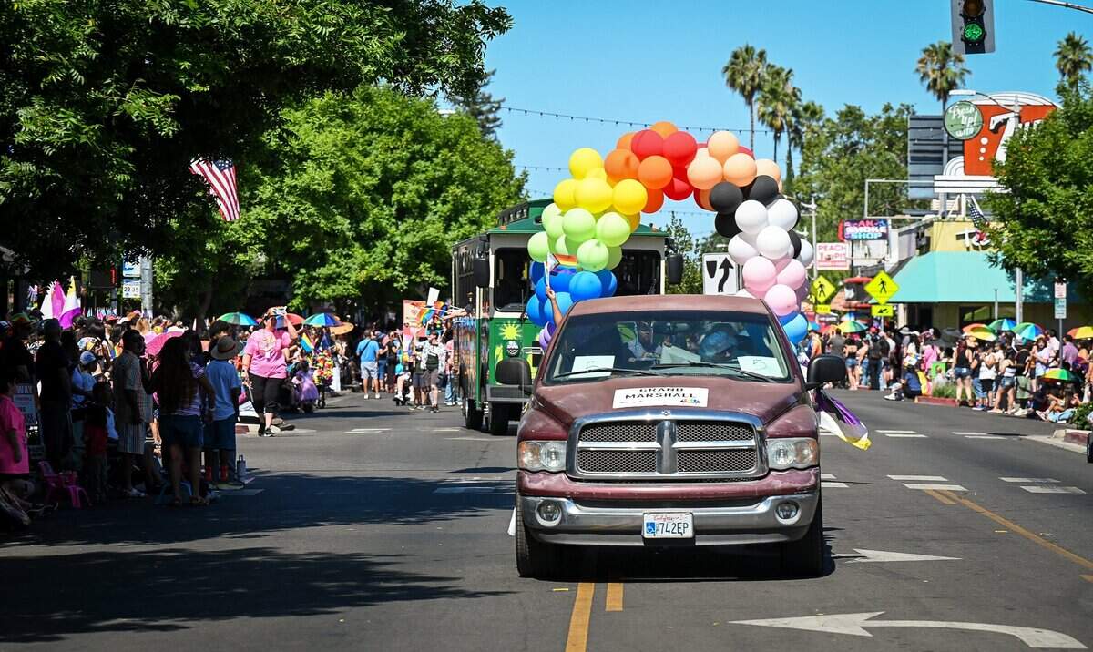 Floats make their way down Olive Avenue in the Tower District as crowds line the sidewalks during the annual Fresno Rainbow Pride Parade and Festival on Saturday, June 6, 2026.