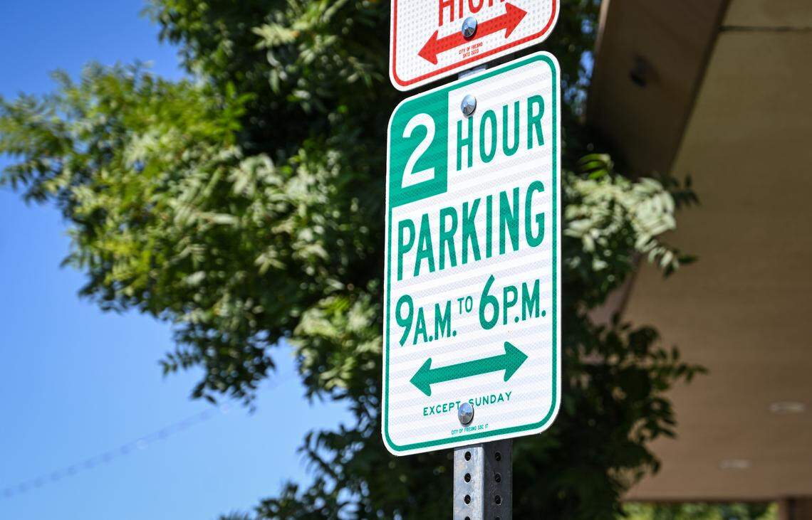 Two-hour parking signs have been posted on Olive Avenue near the Tower Theatre in Fresno’s Tower District.
