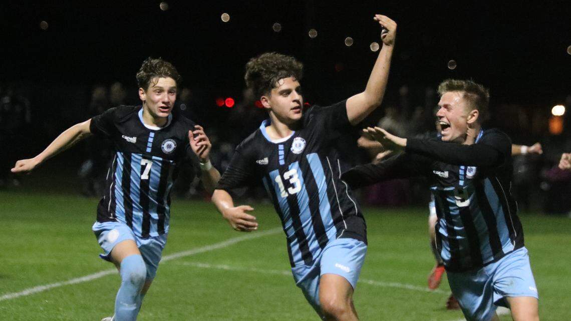 Clovis North junior midfielder Dylan Mostes celebrates a second-half goal during Friday’s CIF Central Section Division I quarterfinal 3-0 win over TRAC rival Buchanan High. Sophomore Nixon Hansen and junior Davis Bosch celebrate as well. No. 1 seeded Clovis North improved to 17-1-5. The two teams had battled to a pair of 1-1 matches in league play.