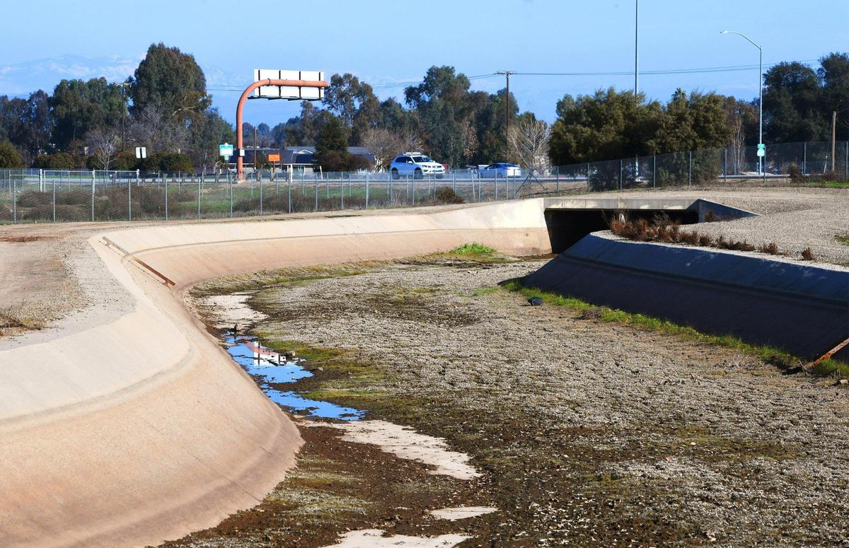 The Enterprise Canal is seen winding its way towards Highway 168 in Clovis, where in March 2025 city leaders mothballed decade-old plans for a pedestrian and cycling bridge spanning the freeway near the Clovis Community Medical Center.