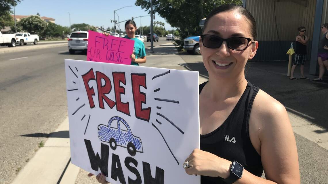 Clovis youth group offering to wash your car for free. No strings attached.