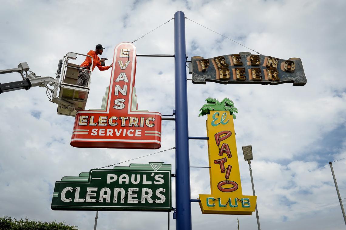Jose Vargas of A-Plus Signs puts the final touches on a neon sign installed outside the Paul Paul Theater at The Big Fresno Fair on Tuesday, Oct. 2, 2018. Four newly restored neon signs have been added to the growing collection of signs from Fresno’s past outside the Fresno Historical Museum. The signs have working lights for fairgoers to enjoy during the evening hours.