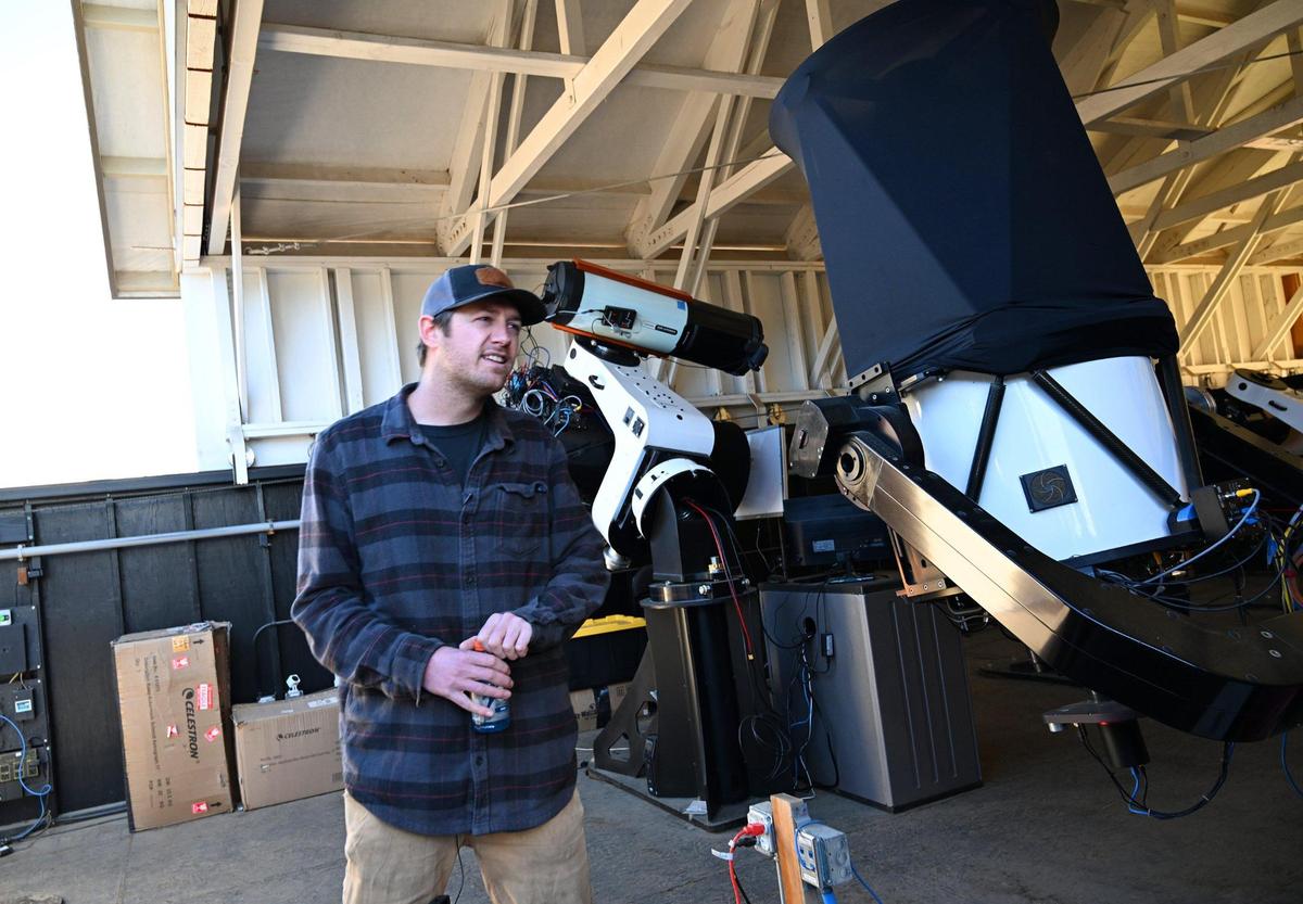 Sierra Remote Observatory technician Sam Miller shows off a few telescopes at the hilltop observatory used by the science field to capture astrophotography images Tuesday, Jan. 21, 2025 near Auberry.