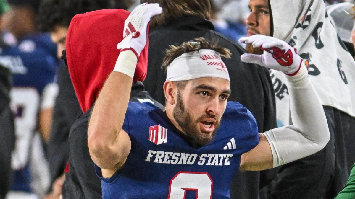 Fresno State’s Mac Delena tries to encourage the fans from the sideline during their game with Hawaii at Valley Children’s Stadium in Fresno on Saturday, Nov. 2, 2024.