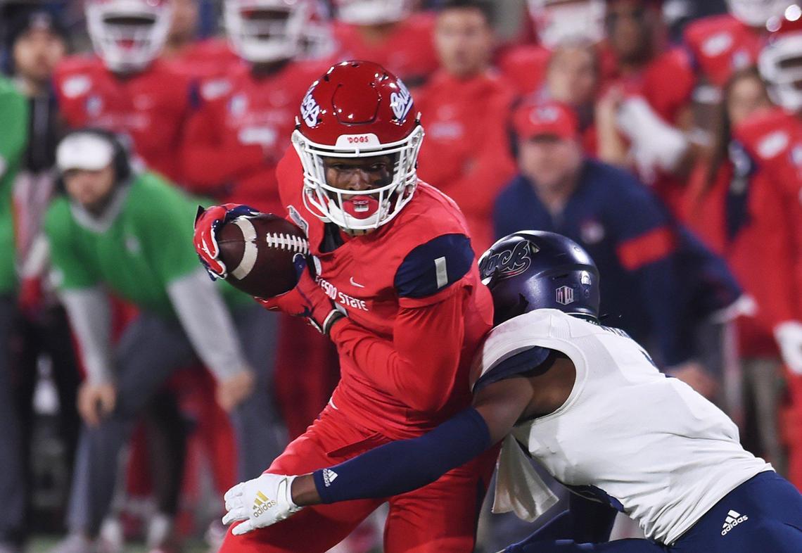Fresno State wideout Keric Wheatfall tries to spin out of a tackle by Nevada’s E.J. Muhammad in the Bulldogs’ 35-28 loss to the Wolf Pack Saturday, Nov. 23, 2019. Wheatfall had four receptions for 35 yards and one touchdown.