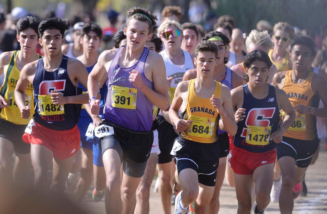 The boys Division II race rounds a corner at the CIF state cross country championships held at Woodward Park Saturday, Nov. 27, 2021 in Fresno.