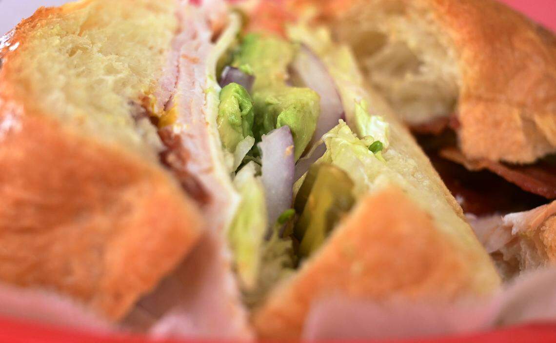 A Turkey, Ham and Bacon croissant sandwich is seen at City Donuts which Tathy Ky and her sister Thida Ky have opened in the former Supreme Donuts location at the corner of Palm and McKinley avenues. Photographed Wednesday, Oct. 22, 2025 in Fresno.
